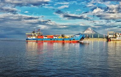 Ship moored on sea against sky