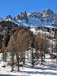 Scenic view of snowcapped mountains against clear sky