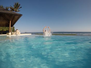 View of swimming pool against clear sky