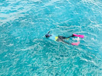 High angle view of teenage girl snorkeling in sea