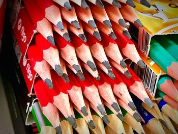 Close-up of multi colored umbrellas hanging in row