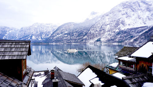 Panoramic view of buildings and mountains against sky