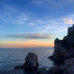 Scenic view of sea against sky at sunset