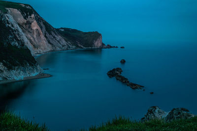 Scenic view of sea against blue sky