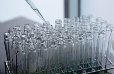 Equipment lab for science research.close up of liquid water dripping  into test tube.