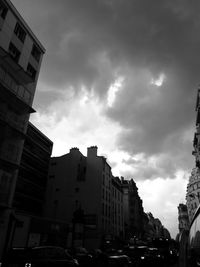 Low angle view of cars on road against sky