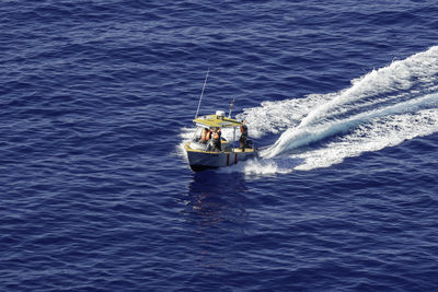 High angle view of people on sea