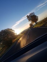 View of road seen through car windshield