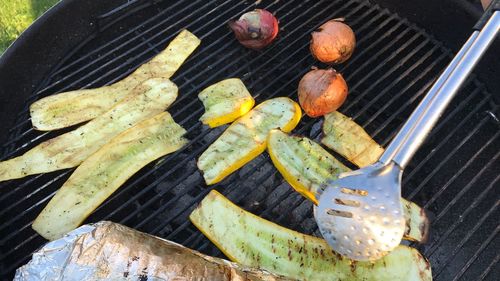 High angle view of meat on barbecue