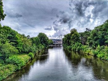 River amidst trees against sky