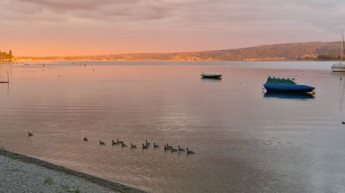 Scenic view of lake against sky during sunset