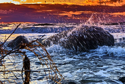 Aerial view of frozen sea during sunset