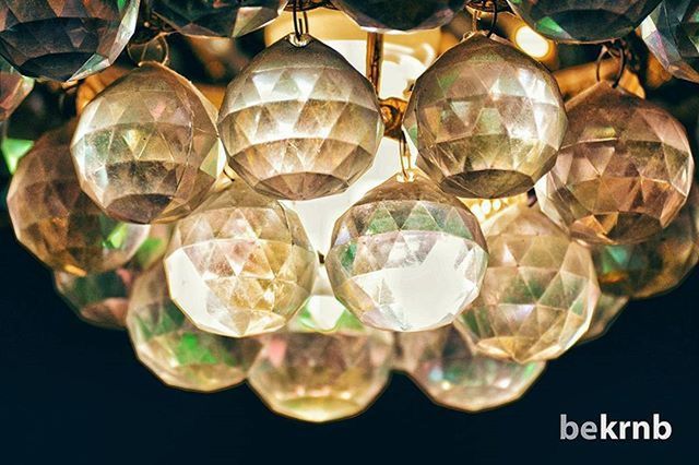 indoors, close-up, glass - material, transparent, still life, studio shot, large group of objects, arrangement, reflection, decoration, in a row, abundance, variation, sphere, side by side, table, hanging, no people, order, focus on foreground