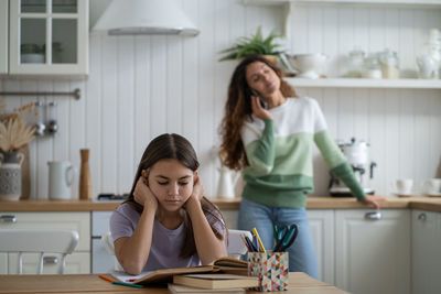 Female friends working at home