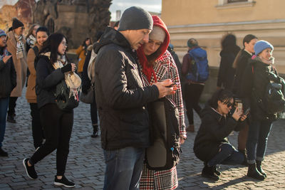 Group of people on street in city