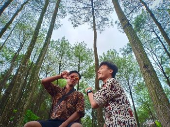 Young man with friend at forest