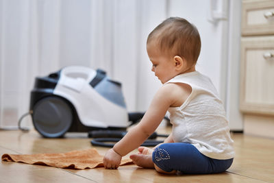 Side view of boy exercising in gym