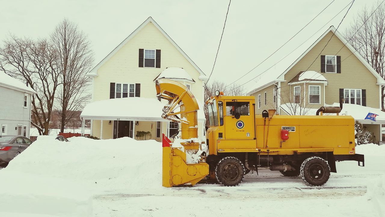 building exterior, architecture, built structure, snow, house, transportation, winter, cold temperature, season, residential structure, residential building, land vehicle, street, yellow, car, mode of transport, bare tree, stationary, day, parked