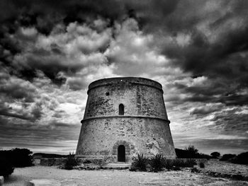 Old building against cloudy sky