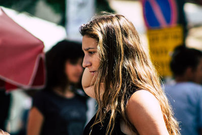 Portrait of young woman looking at camera