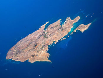 High angle view of island against clear blue sky