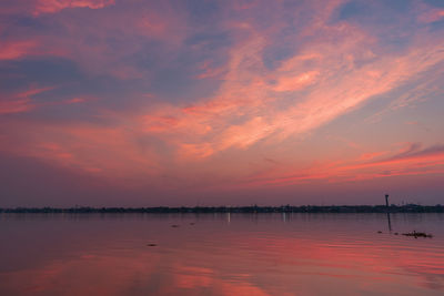 Scenic view of lake against romantic sky at sunset