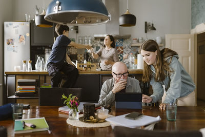 Portrait of female friends working at home