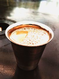 Close-up of coffee cup on table