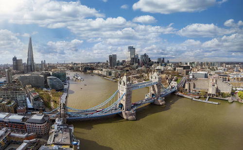 High angle view of river amidst buildings against sky