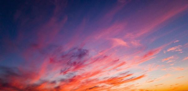 Low angle view of dramatic sky during sunset