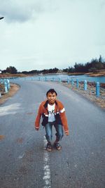 Portrait of young man on road