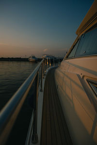 View of yacht in sea during dusk