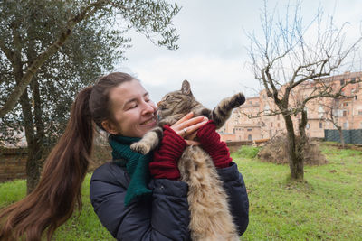 Portrait of woman with cat