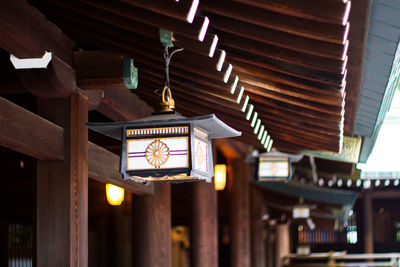 Illuminated lantern hanging at temple