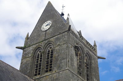 Low angle view of clock tower against sky