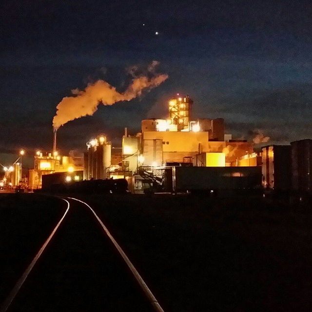 building exterior, illuminated, architecture, night, built structure, sky, city, the way forward, road, street, dusk, street light, building, cloud - sky, residential building, transportation, outdoors, diminishing perspective, no people, residential structure