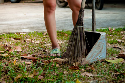 Low section of person working on plants