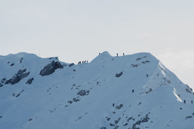 Scenic view of snow covered mountains against sky