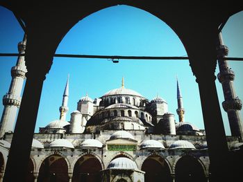 Low angle view of mosque against sky