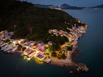 High angle view of sea and buildings in city