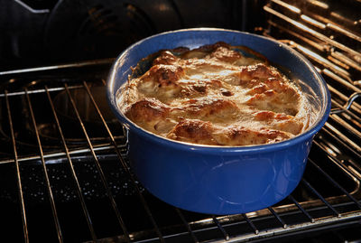 Bechamel sauce, cauliflower in ceramic bowl after baking in the oven