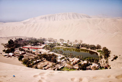 Aerial view of desert against clear sky