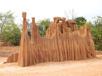 Rock formations on landscape against sky