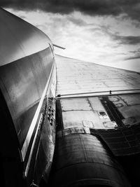 Low angle view of built structure against cloudy sky