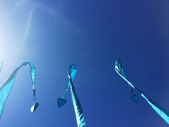 Low angle view of tree against blue sky