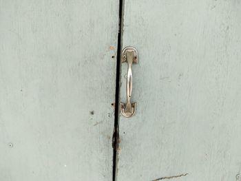 Close-up of door knocker on wall