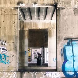 Man standing on bridge