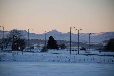 Scenic view of mountains against clear sky during winter