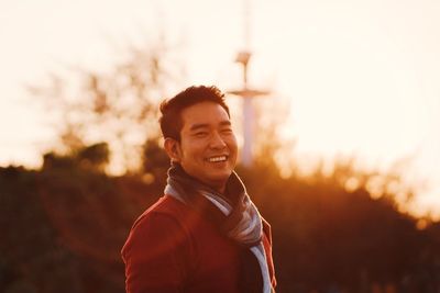 Portrait of smiling man standing outdoors