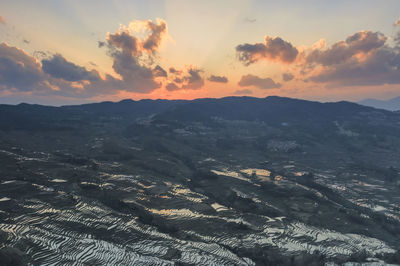 Scenic view of rice terraces at yuanyang county during sunset